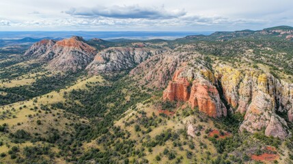 Naklejka premium Majestic Rocky Landscape Under Dramatic Clouds and Blue Sky