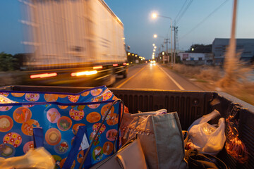 The drive at sunset on a load space of pickup truck with luggage © milkovasa