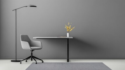 Modern minimalist home office interior design with grey chair, desk, and floor lamp against a grey wall