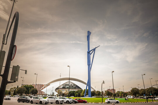 VALENCIA, SPAIN - OCTOBER 13, 2024: The roundabout sculpture 'A la dona i a la ciencia' ('El Parotet') by Miquel Navarro near Valencia's City of Arts and Sciences, standing prominently in landscape.