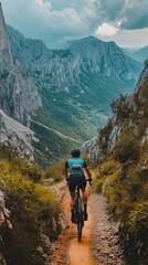 Cyclist navigates a rocky mountain trail amidst stunning natural beauty