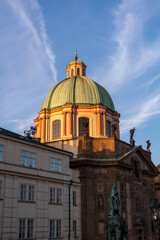 Scenic view of Prague at sunset with historic architecture, Charles Bridge, and the Vltava River. A beautiful European cityscape showcasing medieval buildings, gothic landmarks, and cultural heritage