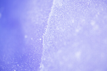 Close up texture of frozen lake cracked ice as background