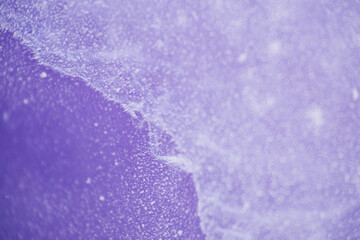 Close up texture of frozen lake cracked ice as background