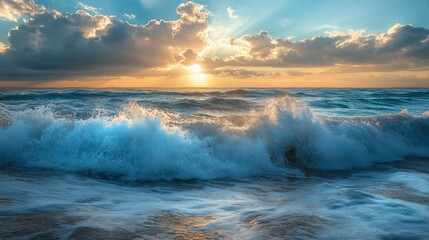 Obraz premium Ocean Waves Crashing on Sandy Beach at Sunset