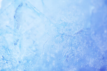 Close up texture of frozen lake cracked ice as background