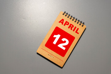April 12 text on wooden blocks. Calendar concept with customizable space