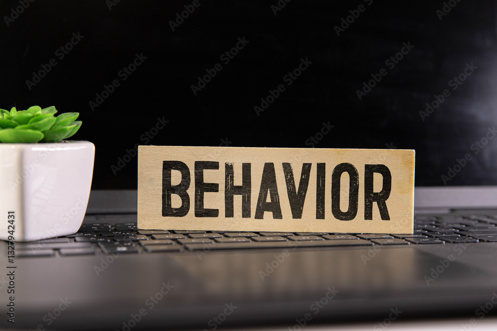 Poster behavior word made of building blocks on a light yellow background