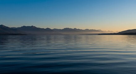 Fototapeta premium Serene Lake at Sunrise, Mountain Silhouette