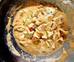 Cooking pork Panang curry  in pan , Thai famous food.