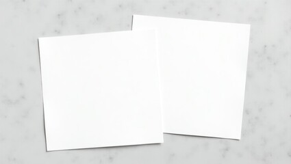 Two paper invitation cards placed on a stylish grey background with blank space for card design presentation.