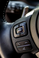 Inside the car.Multimedia leather steering wheel in a modern expensive car.Dashboard, inner...