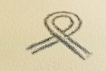 Hand-drawn sketch of a ribbon on textured background for awareness