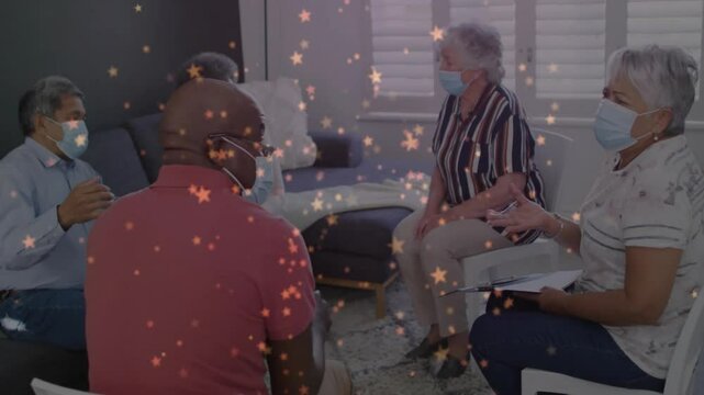 Group of people wearing masks having discussion with star animation overlay
