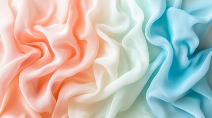 Obraz premium Soft pastel fabric texture background in peach, cream, and blue hues.