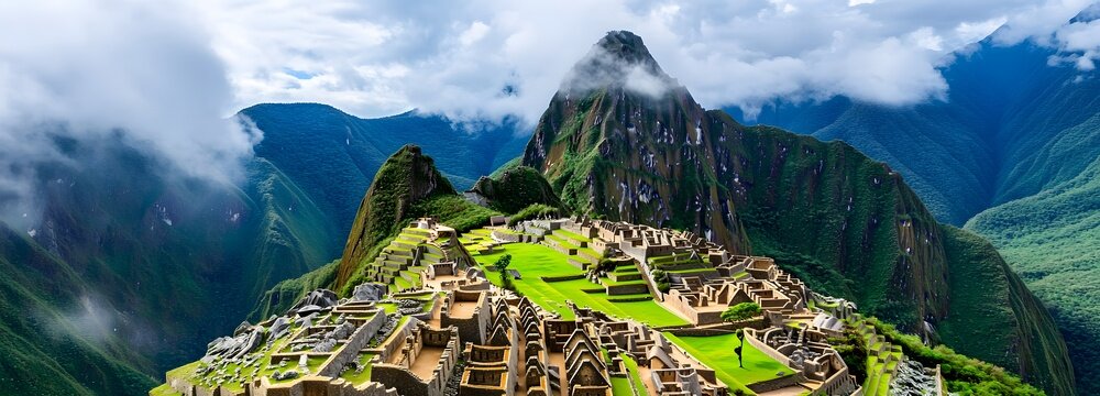 A breathtaking view of Machu Picchu, mist rolling through the ancient ruins