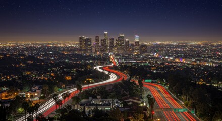 Fototapeta premium A stunning city skyline at night, glowing with thousands of lights. Car headlights create lively streaks on winding roads, while a starry sky enhances the urban charm.