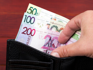 Belarusian ruble in the black wallet