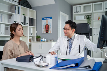 Obraz premium Asian young woman visit and consult health problem with doctor in hospital. 