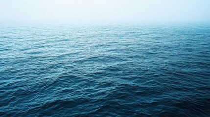 Obraz premium Vast Ocean Serenity: A Tranquil Seascape Under a Misty Sky
