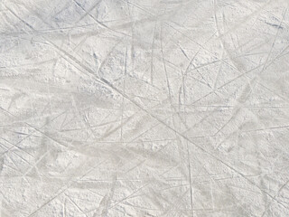 Ice background with marks from skating and hockey.