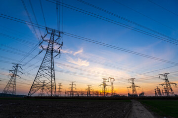 The pylons are in the evening, Substation in the evening, High voltage substation and beautiful sunset glow