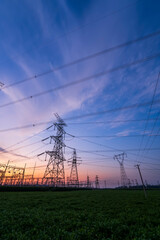 The pylons are in the evening, Substation in the evening, High voltage substation and beautiful sunset glow