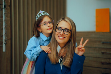 Mother and Daughter Wearing Sunglasses Being Cool Together. Happy mom and child in an optical store choosing eyeglasses