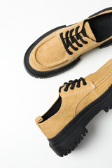 Stylish boots with a thick sole on a white background