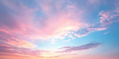Obraz premium A dreamy sunset sky painted in soft pink and baby blue hues, resembling cotton candy