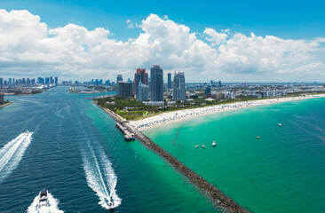 Top view of South Miami Beach and the ocean. Miami skyline with skyscrapers. Aerial view of Miami in summer. Miami shore with luxury buildings. Scenic drone view of Miamis famous coastline.