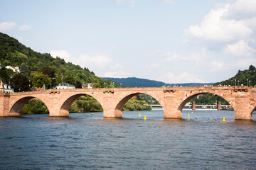 Fototapeta premium German and foreigner travelers walking and visit on Karl Theodor Bridge or Old Bridge of Heidelberg cross over Neckar River
