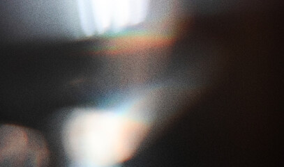 Prism light leak colorful photo overlay on black background.