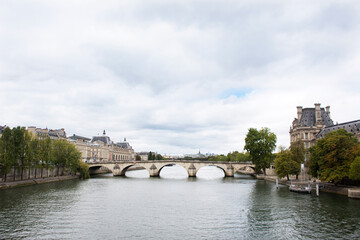 Obraz premium View landscape and cityscape of Paris city with river cruises sailing in Seine river