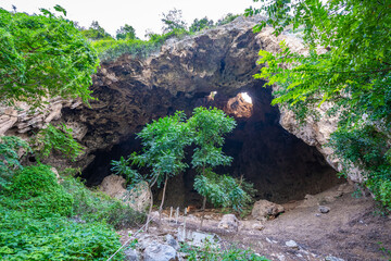 Bo Cave, part of Khao Iko in Phetchaburi, has a wide entrance, high chamber, stalactites, and...