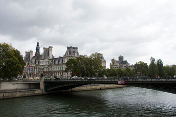 Fototapeta premium View landscape of Paris city at riverside of Seine river and Hotel de Ville with traffic road