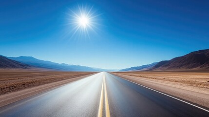 long empty highway stretches into horizon under clear blue sky emphasizing sense of freedom and exploration with ample