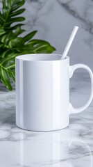 White Ceramic Mug on Marble Surface with Green Leaves