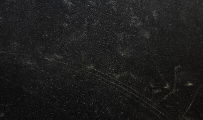 Black background, grunge texture design. Scratched and dirty background. Abstract grunge texture isolated on black background. 