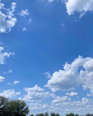 A vast, sunlit field stretches across the landscape, dotted with a herd of content cows grazing peacefully on lush green grass, surrounded by gentle hills and a clear blue sky.