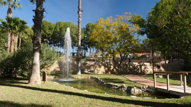 Fountain in a mediterranean park. Slow motion x0.5. Crevillente, Spain.