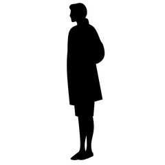 Silhouette of a young girl standing alone with a backpack. Represents concepts of education, independence, childhood, and learning