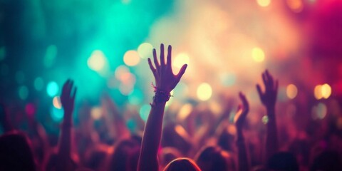 Beach Party: Blurred Crowd Cheering with Hands in the Air at Music Festival During Summer Sunset Vacation