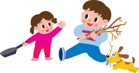 キャンプで薪を集める子供たちと犬
