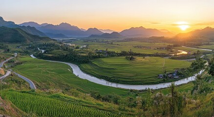 Obraz premium Serene Landscape of Lush Rice Fields Under a Golden Sunset in a Valley Surrounded by Majestic Mountains and Flowing River in Rural Region