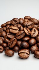 Naklejka premium Glistening Dark Brown Roasted Coffee Beans on Off White Background