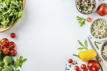 Fresh quinoa salad ingredients arranged white background, featuring leafy greens, tomatoes, bell pepper, and broccoli, creating vibrant and
