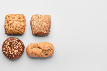 Different delicious buns on white background