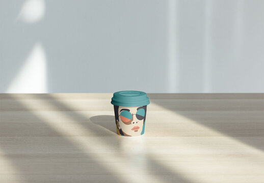 Mockup of a Reusable Coffee Cup With Lid Ideal for Takeaway Drinks