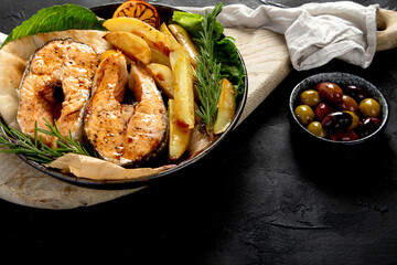 Grilled salmon with potato in menu..